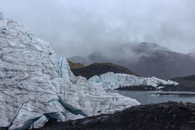 Scenic view of frozen lake against mountain