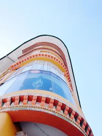 Low angle view of ferris wheel against clear sky