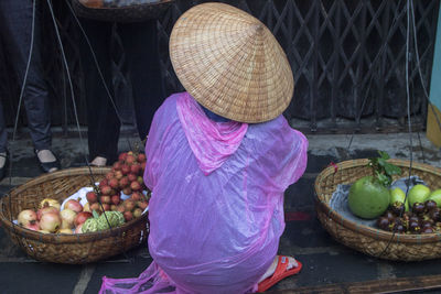 Rear view of woman at fruits market