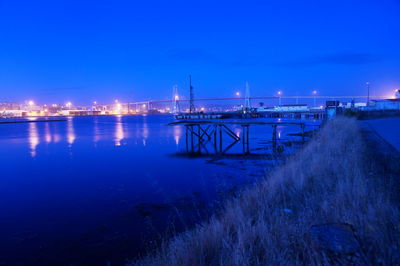 View of harbor against clear blue sky