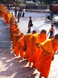 Close-up of people walking on road