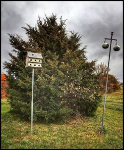 Road sign against sky