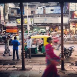 Woman standing on city street