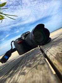 Low angle view of camera against sky