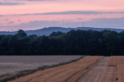 Scenic view of landscape against sky during sunset