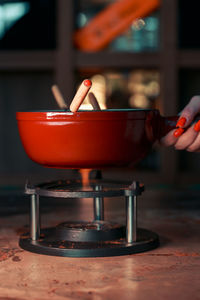 Cropped hand of person preparing food