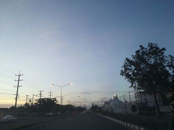 Street against sky during sunset
