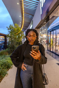 Young woman using mobile phone