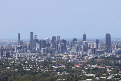 Modern buildings in city against clear sky