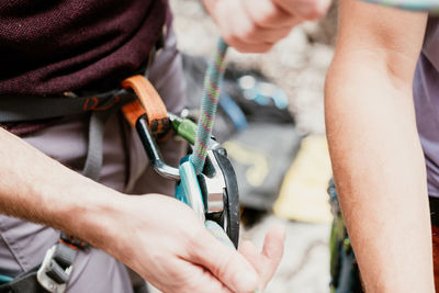 Midsection of man repairing vehicle