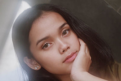 Close-up portrait of young woman