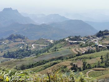 Scenic view of landscape and mountains against sky