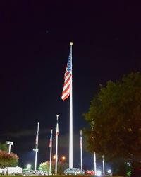 Low angle view of american flag at night