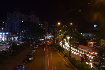 High angle view of light trails on road at night