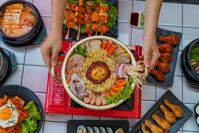 High angle view of person preparing food on table