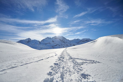 Scenic view of snowcapped mountains against sky