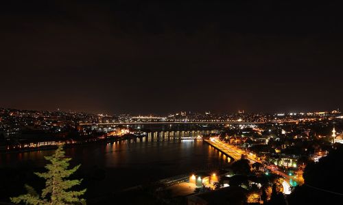 High angle view of illuminated buildings in city at night