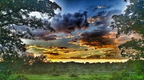 Scenic view of landscape against cloudy sky