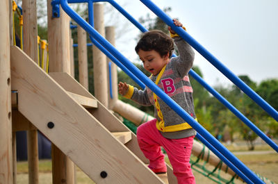 Happy girl playing at playground