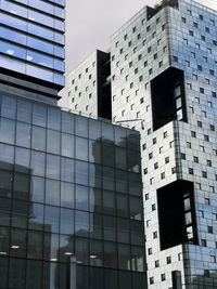 Low angle view of modern building against sky in city