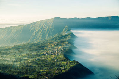 Scenic view of mountains amidst clouds