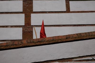 Low angle view of flag against building