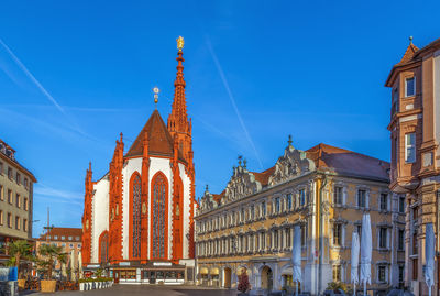 Low angle view of historical building against blue sky