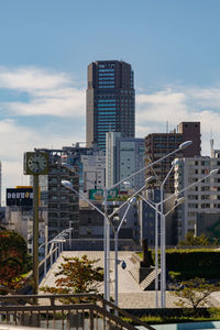 Modern buildings in city against sky