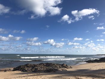 Scenic view of beach against sky