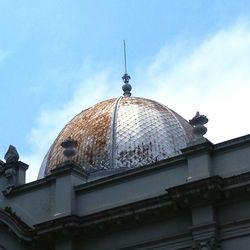 Low angle view of dome building against sky