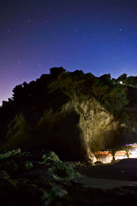 Scenic view of mountain against sky at night