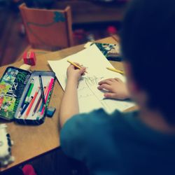 Close-up of human hand on paper