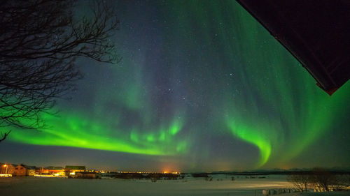 Low angle view of illuminated sky at night