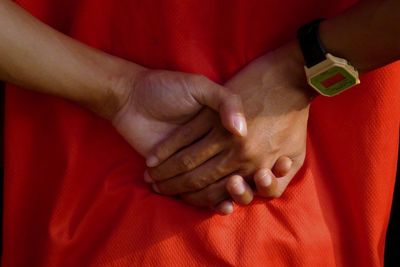 High angle view of people with hands