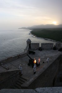 High angle view of man by sea against sky