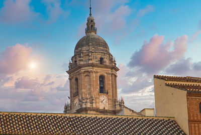 Low angle view of building roof against sky