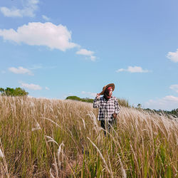 Scenic view of agricultural field against sky