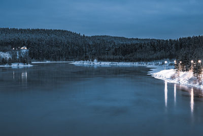 Scenic view of frozen lake against sky during winter