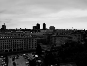 High angle view of cityscape against cloudy sky