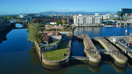 High angle view of river amidst buildings in city