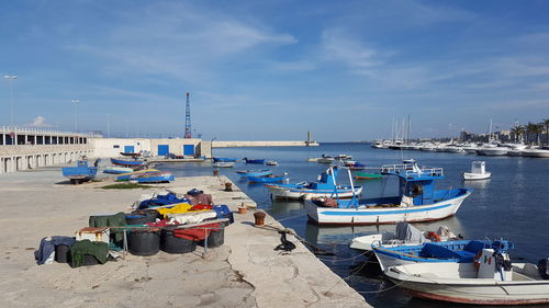 Boats moored on beach against sky