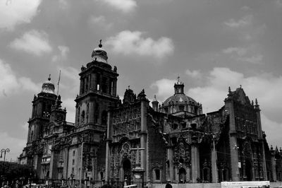 Low angle view of church against cloudy sky