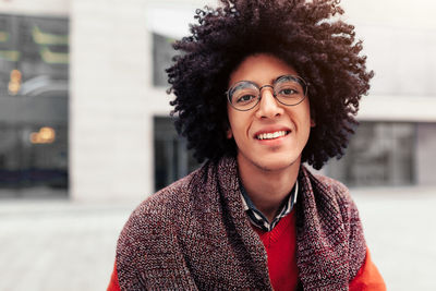 Portrait of smiling young man with frizzy hair