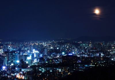 Cityscape against sky at night