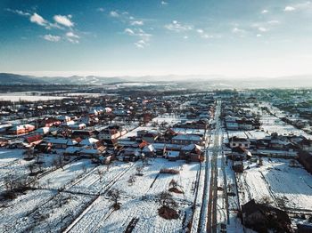 High angle view of buildings in city during winter
