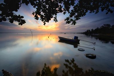 Scenic view of lake against sky during sunset