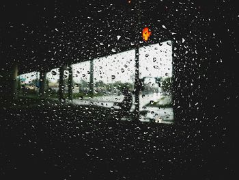 Full frame of glass covered with raindrops