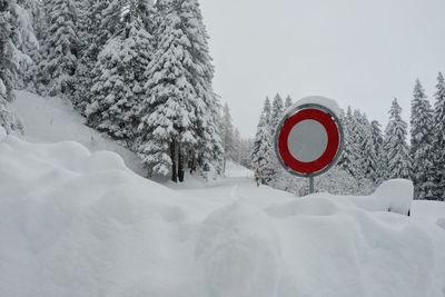 Snow covered landscape against sky