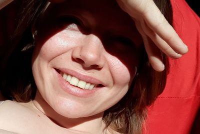 Close-up portrait of a smiling young woman