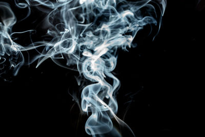 Close-up of smoke against black background